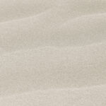 Natural pink sand on the beach background